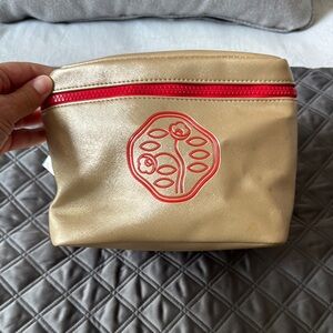 Shiseido Gold and Red Cosmetic Bag with Structured Design